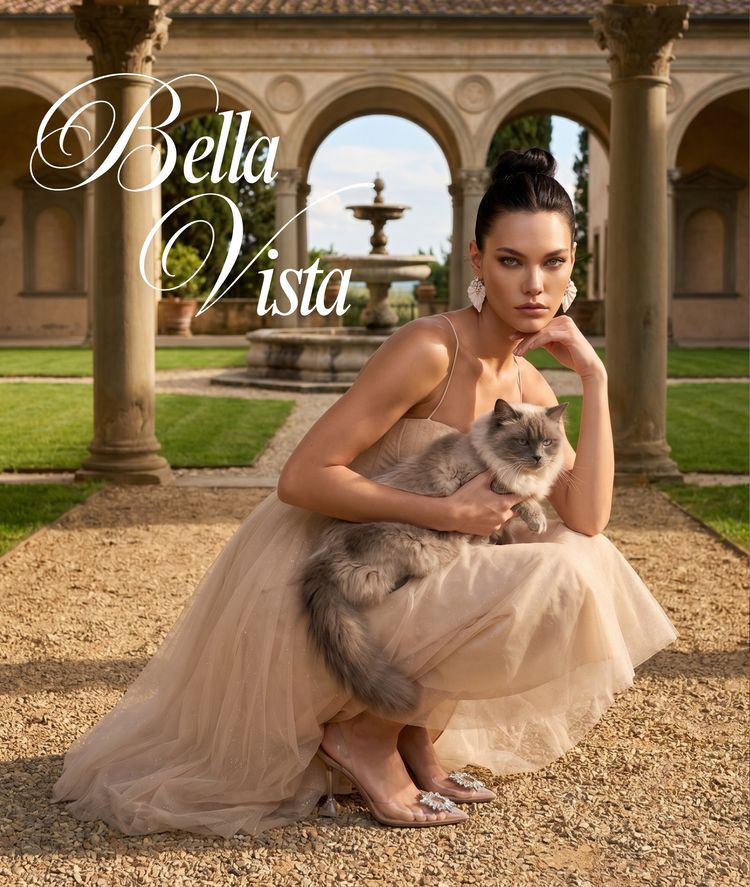 Vertical mobile campaign banner for Dione Boutique featuring a close-up profile of a model wearing a premium champagne tulle bustier corset dress paired with statement silver drop earrings from Dione collection, holding a fluffy grey ragdoll cat in a luxury Italian villa estate backdrop.