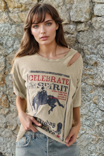 Distressed cowboy graphic tee with slashed shoulder cutouts and "Celebrate the Spirit Saturday Night Rodeo" print. 100% cotton, loose fit, designed in LA.